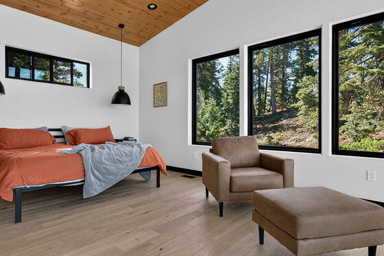 Bedroom under a wood ceiling