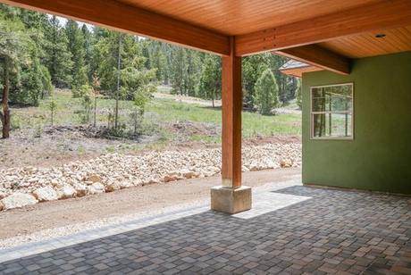 Under the patio roof, looking into the pines