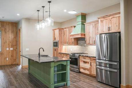Green island, hickory cabinets, black granite
