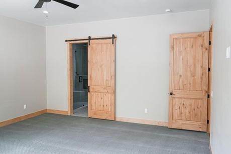 Primary bedroom, barn door to the bath