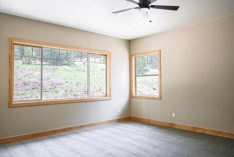 Bedroom with the hillside in the window