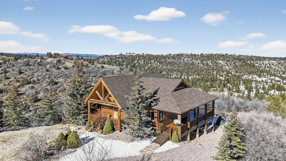 2175 W Manitoban Trail — a log cabin on 10.6 acres above Duck Creek Village