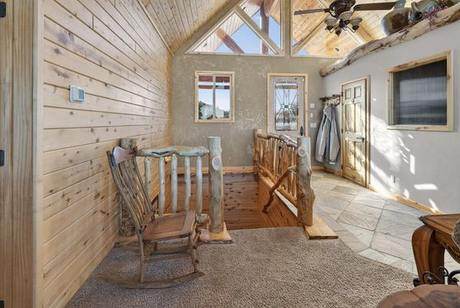 Entry, log rail and timber trusses